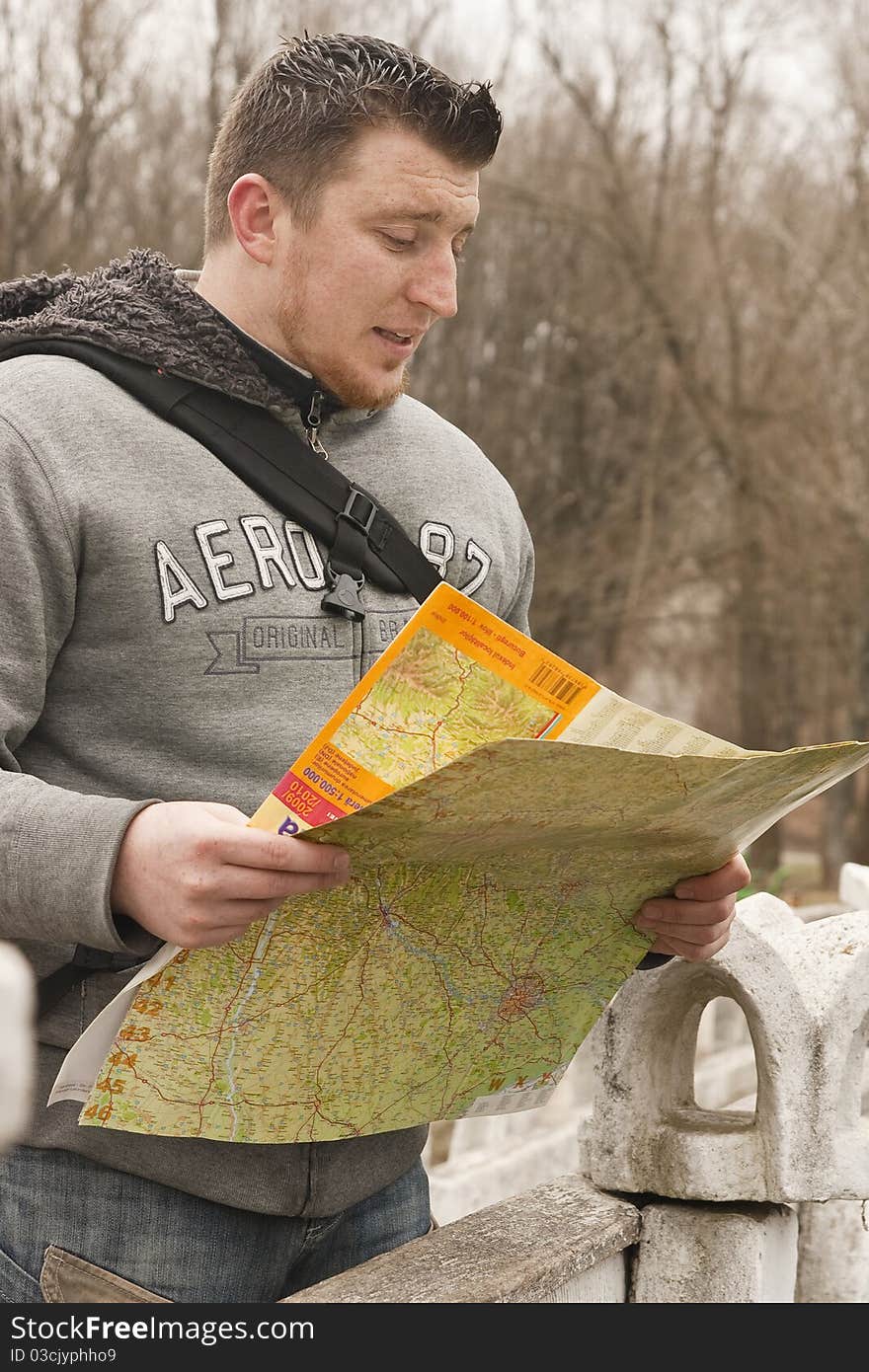 Young boy search destination on the map in moldova