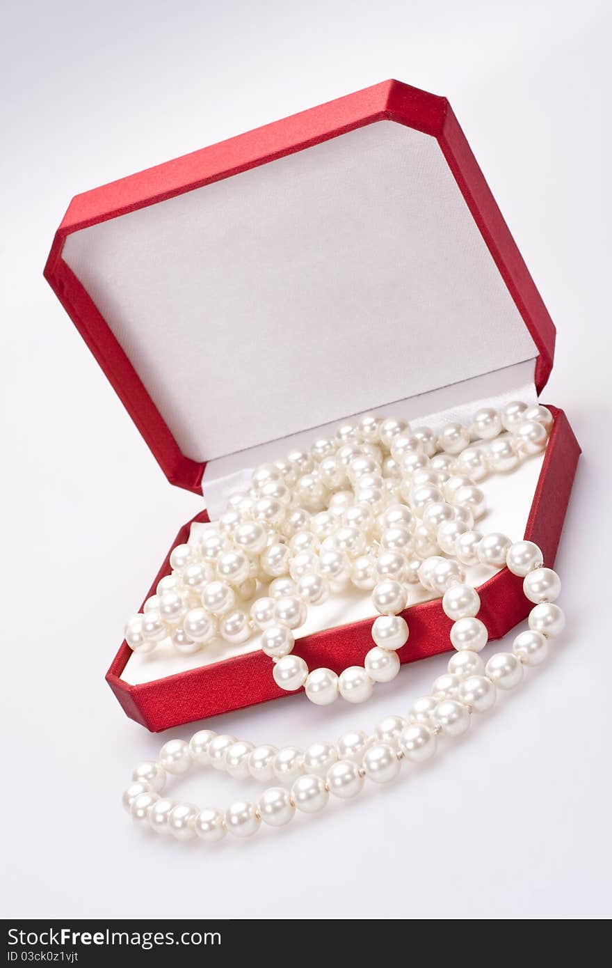 Pearls in a red box