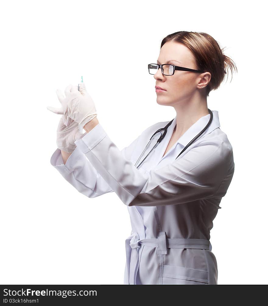 The girl in medical gloves with a syringe in the studio on a white background