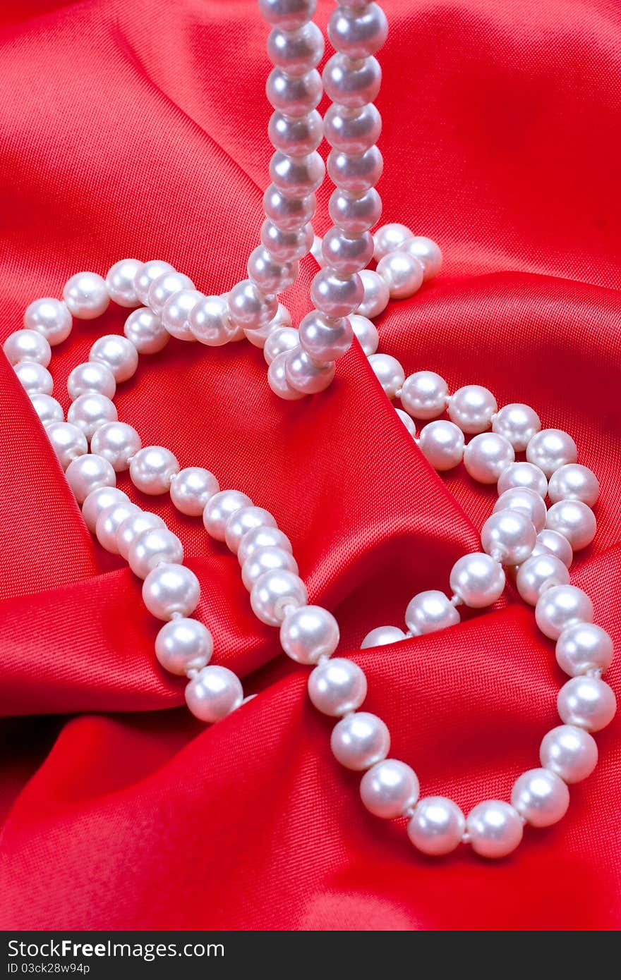 Jewels on white satin as a background