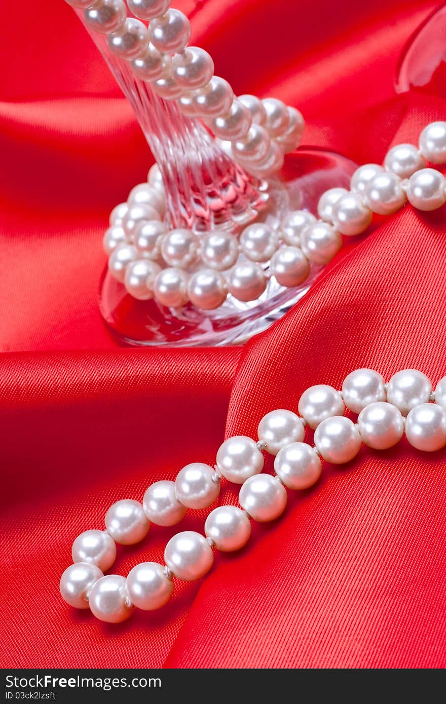 Jewels on white satin as a background