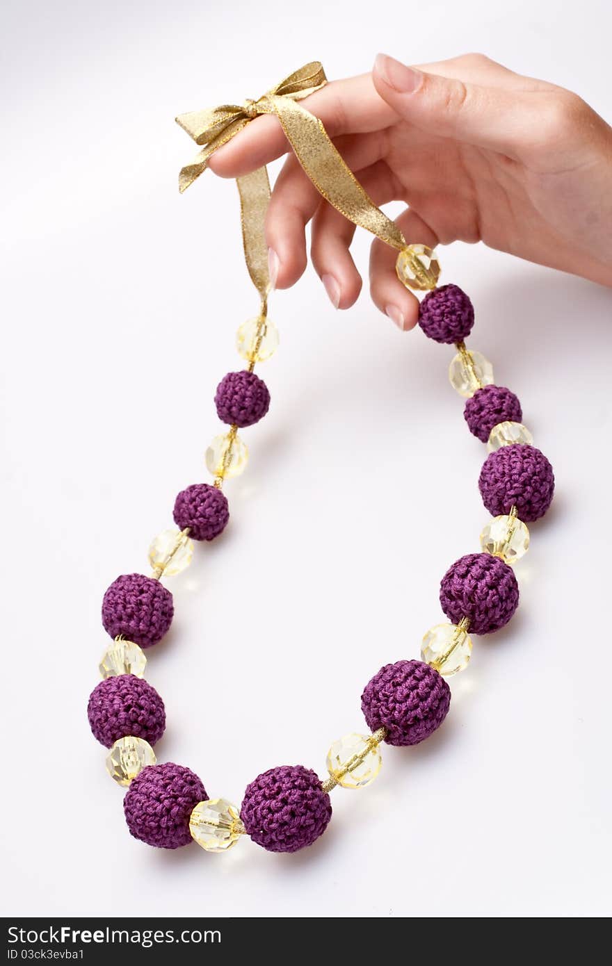 Necklace of beads knitted