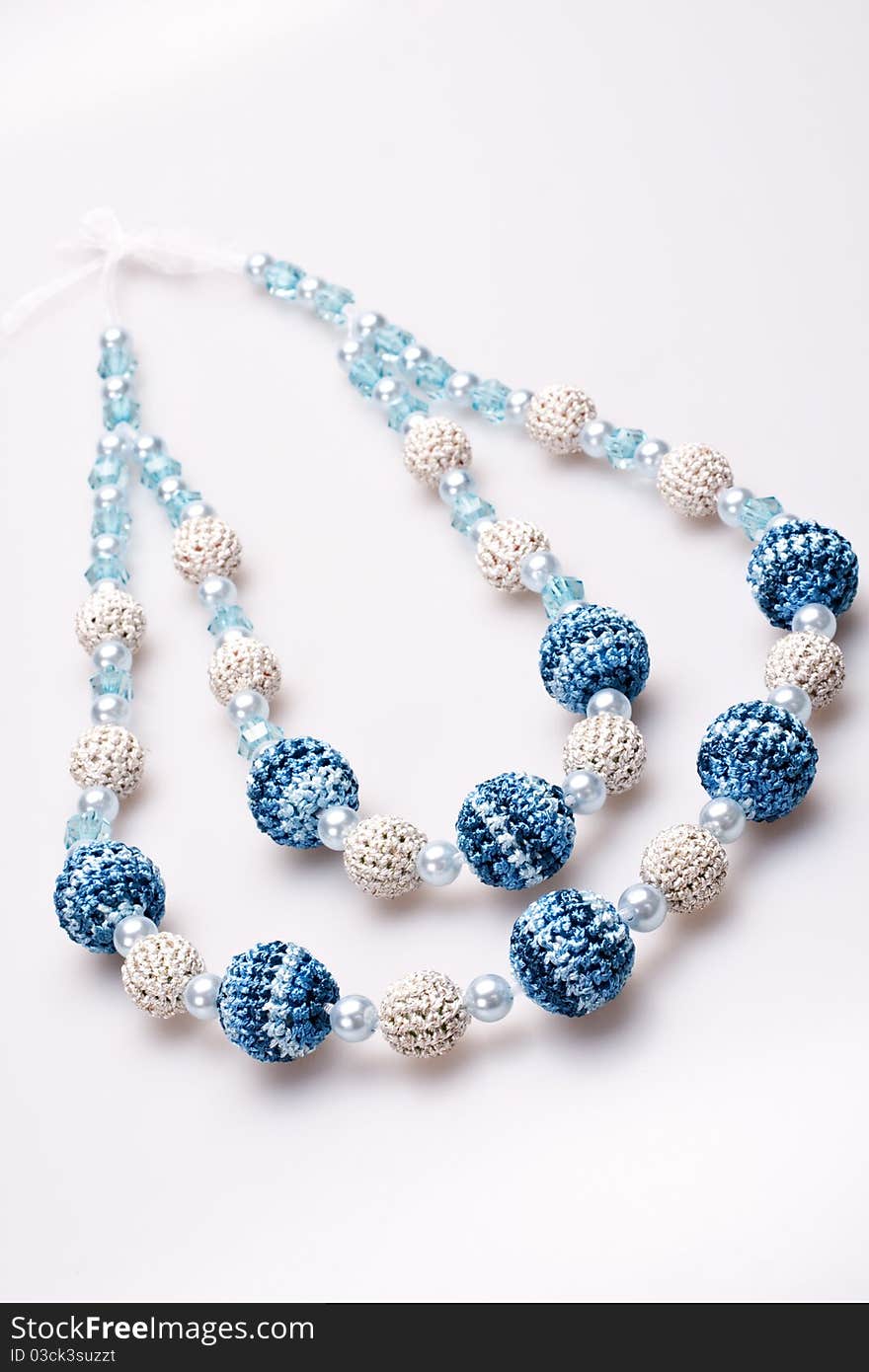 Necklace of beads knitted