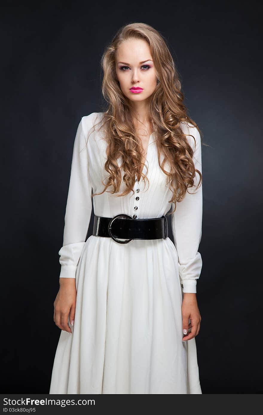 Girl in long white dress, studio isolated shot