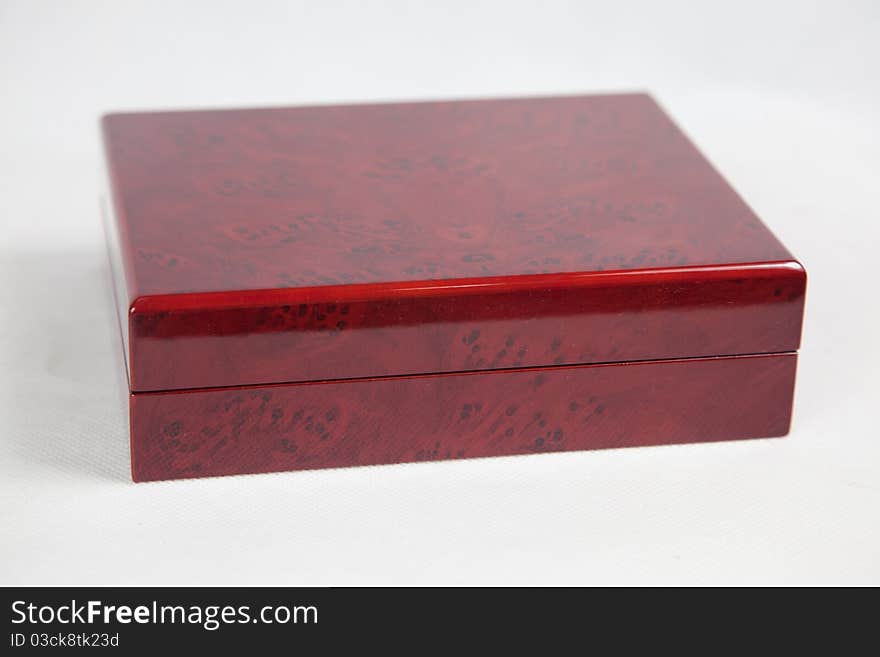 Red closed packaging for jewelry, close up studio isolated shot