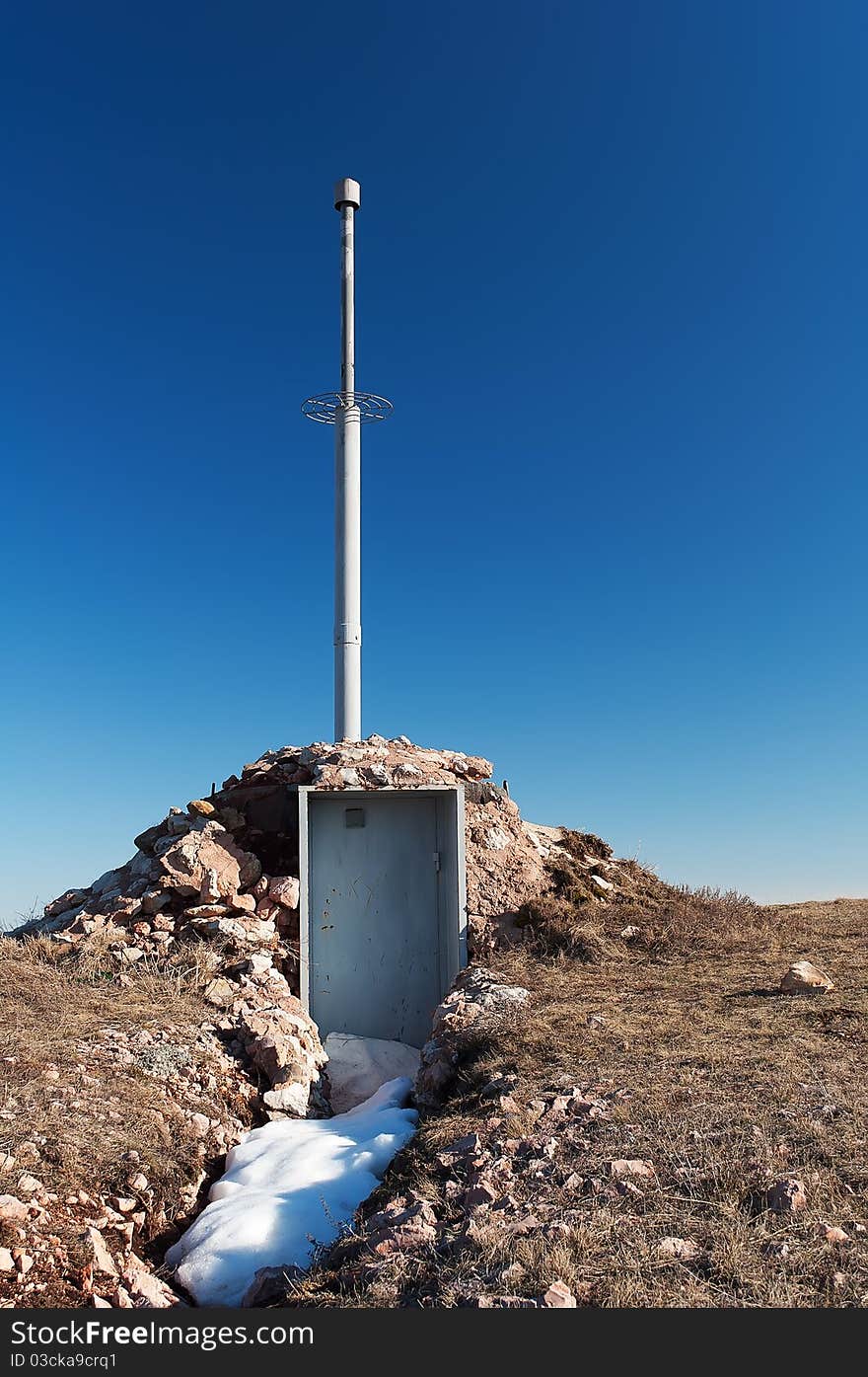 Antenna and a container with equipment on the mountain Chater Dag in Crimea