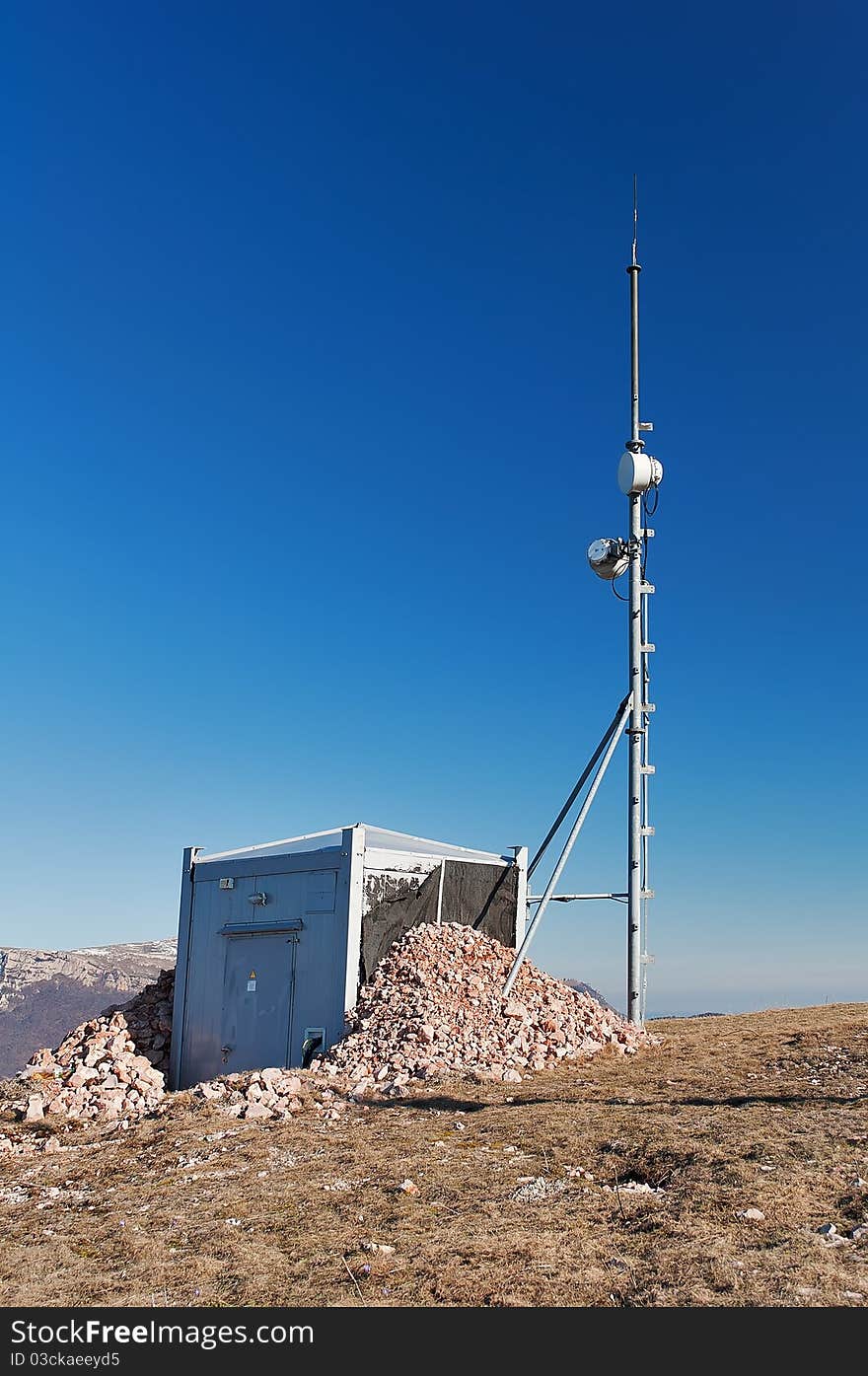 Antenna and a container with equipment on the mountain Chater Dag in Crimea