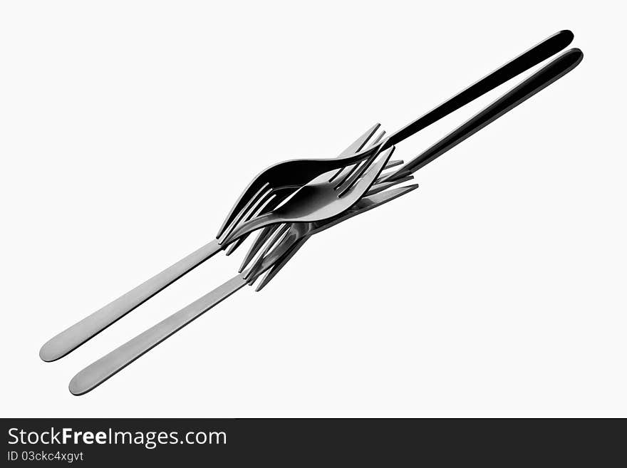 Two forks tangled up on reflecting white background. Two forks tangled up on reflecting white background