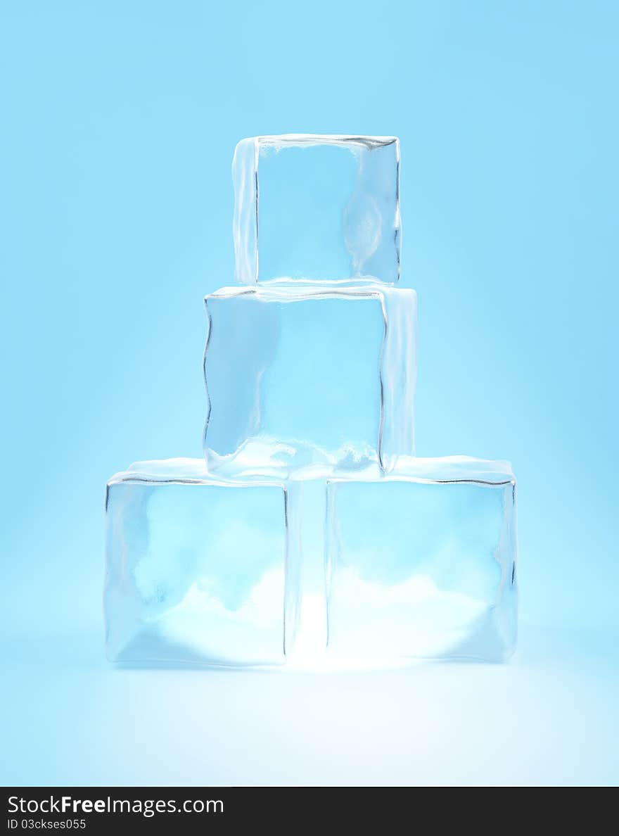 Ice cubes on cyan background