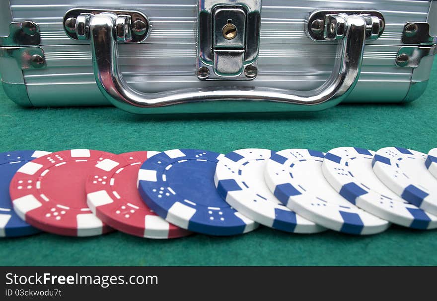 Many poker chips on a green background. Many poker chips on a green background