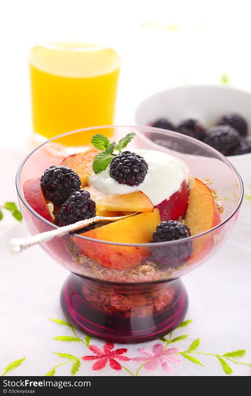 Muesli with fresh berries, fruit and yoghurt