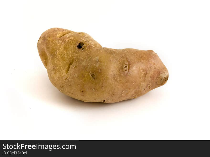 Single Misshapen Potato Over White