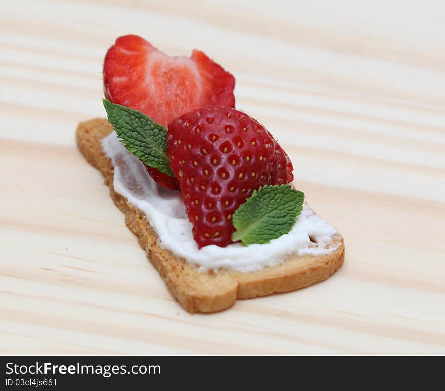 Tasty snack toast sandwich on a wooden surface.