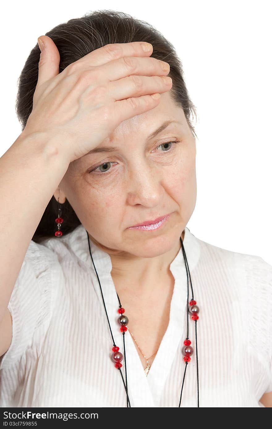 Woman having a headache holding her forehead in pain. Woman having a headache holding her forehead in pain