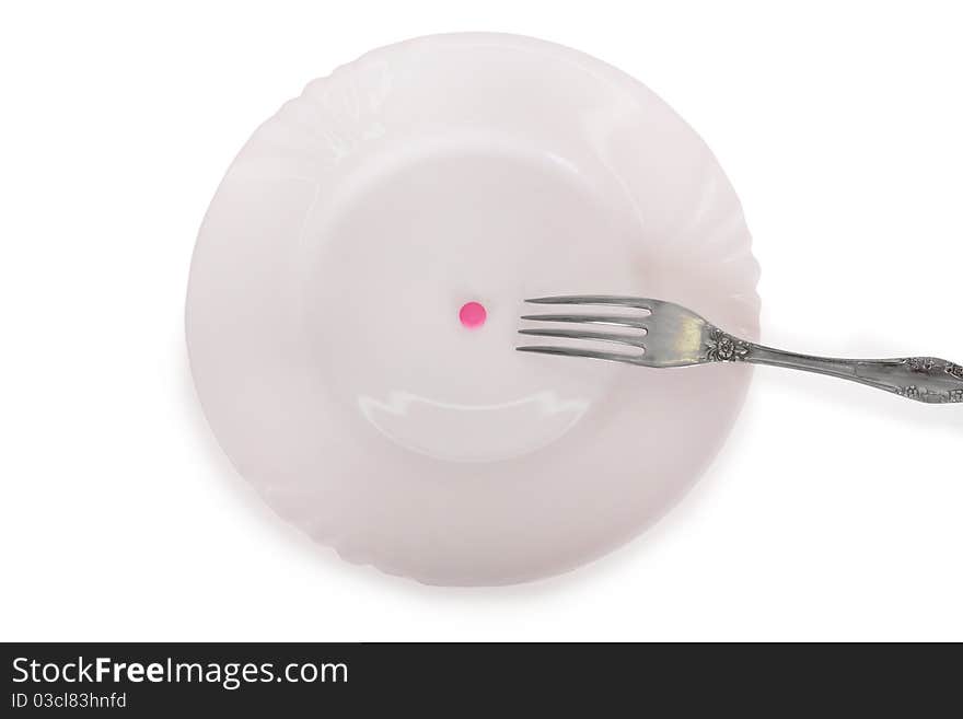 Pink tablets on a white plate isolated on white background. Pink tablets on a white plate isolated on white background