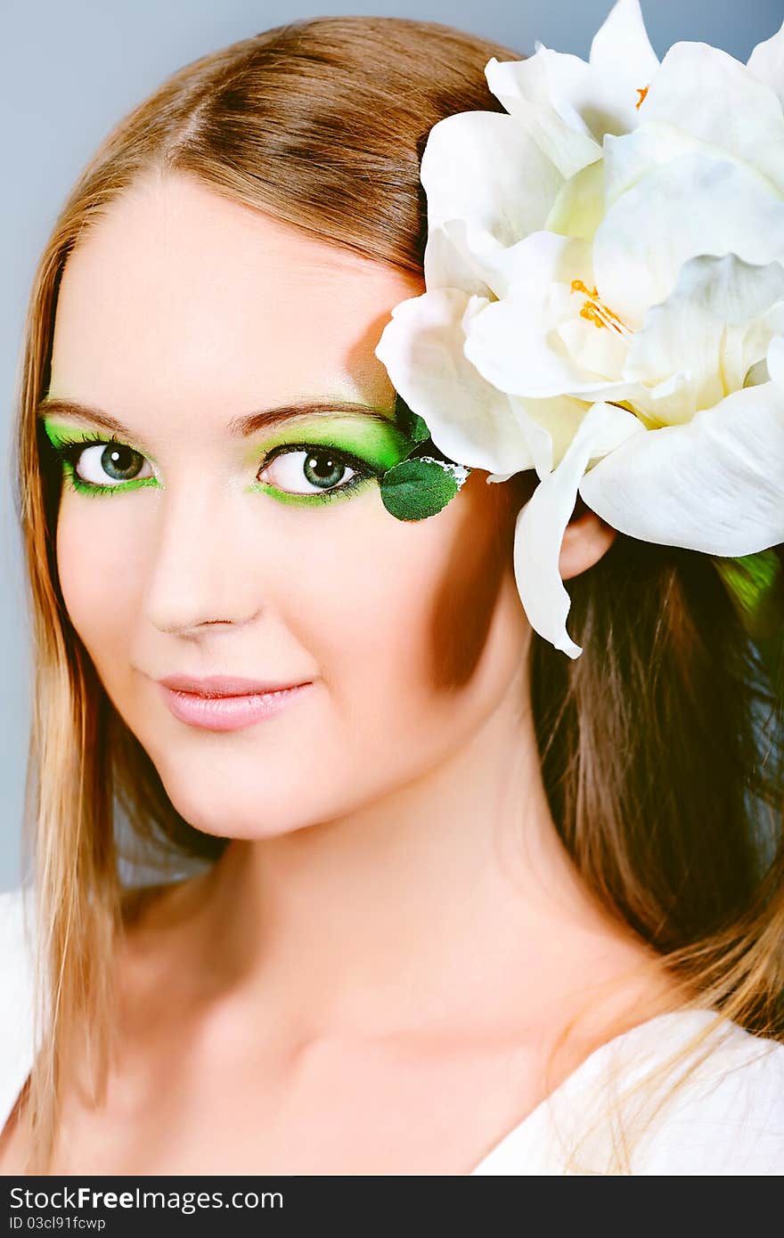 Portrait of a beautiful young woman with spring make-up. Beauty, fashion. Portrait of a beautiful young woman with spring make-up. Beauty, fashion.