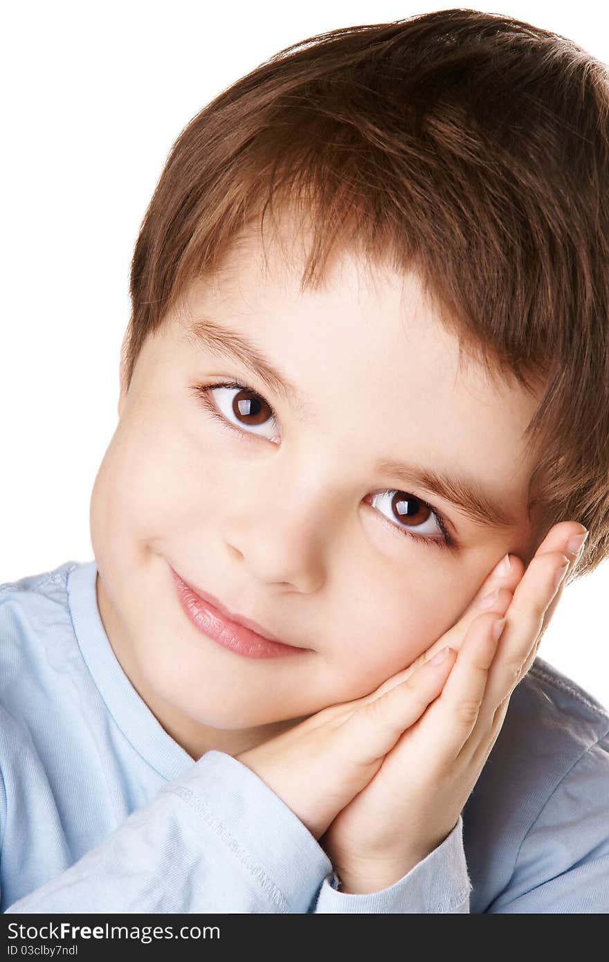 Close-up portrait of beautiful smiling little boy with hands near his face isolated on white background. Close-up portrait of beautiful smiling little boy with hands near his face isolated on white background