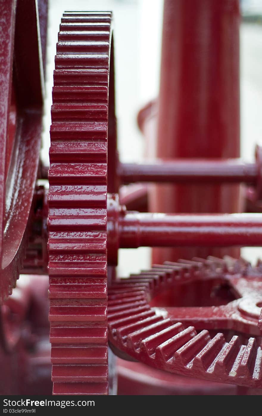 Red cog wheels in an old crane. Red cog wheels in an old crane