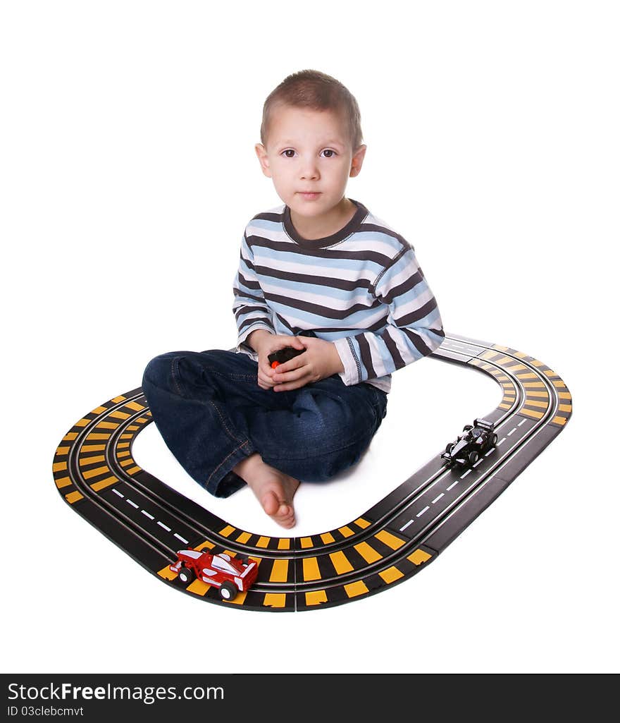 Kid playing with toy car trek isolated on white background. Kid playing with toy car trek isolated on white background