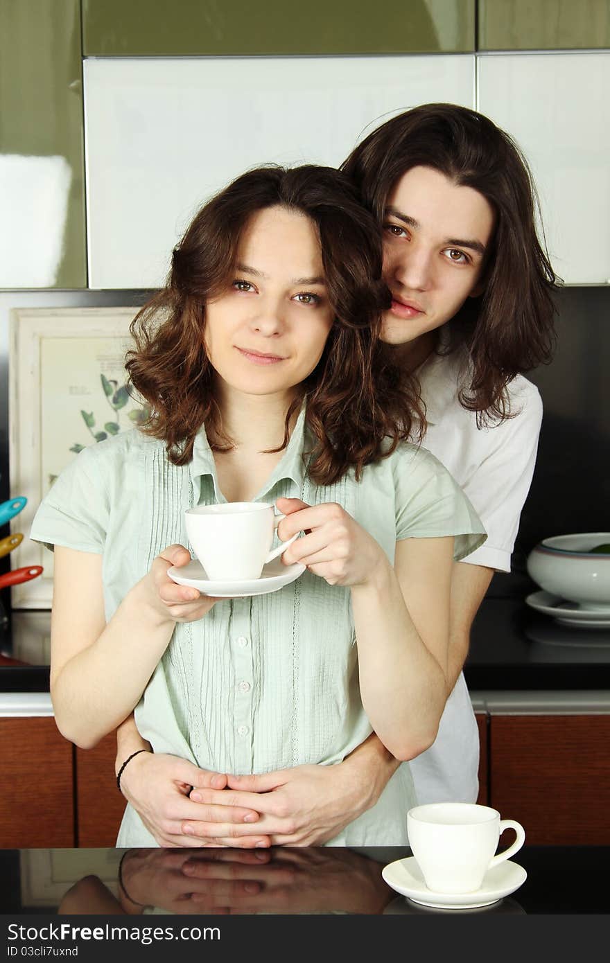 Happy couple in their kitchen