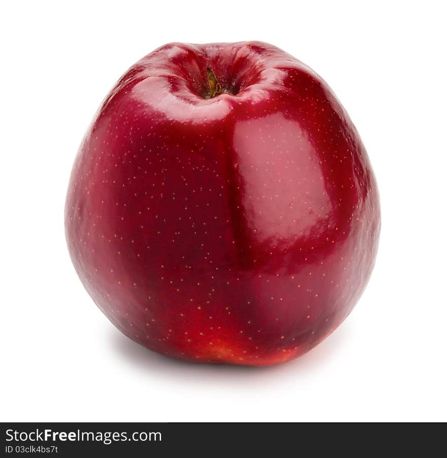 Ripe and juicy red apple a shank downwards isolated on a white background. Ripe and juicy red apple a shank downwards isolated on a white background