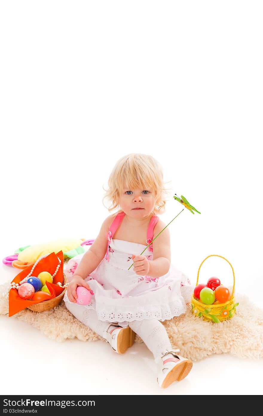 Blonde haires little girl with easter eggs