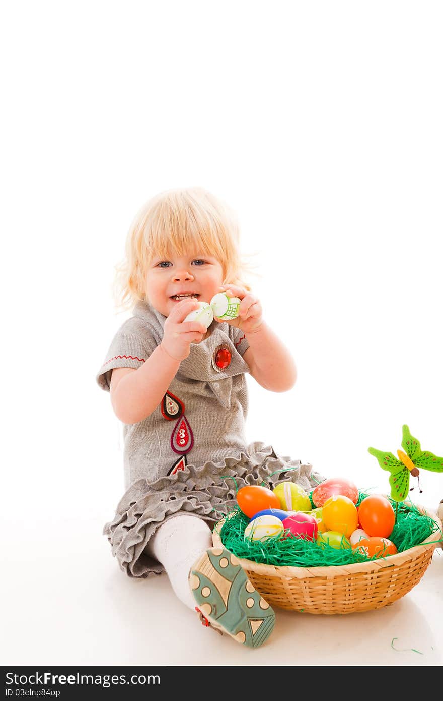 Blonde haires little girl with easter eggs