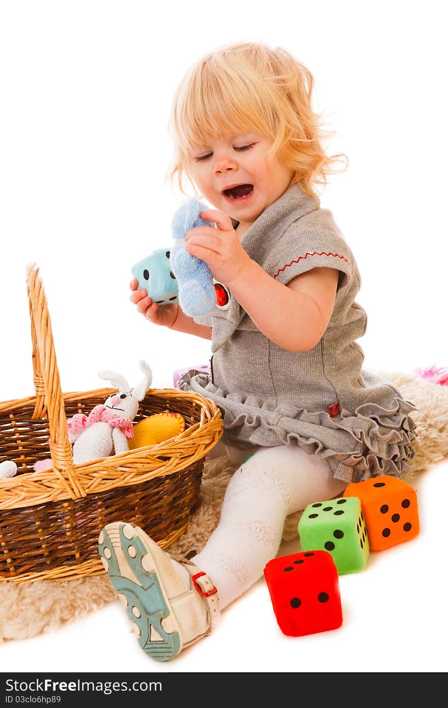 Little blonde haired girl playing with toys. Little blonde haired girl playing with toys