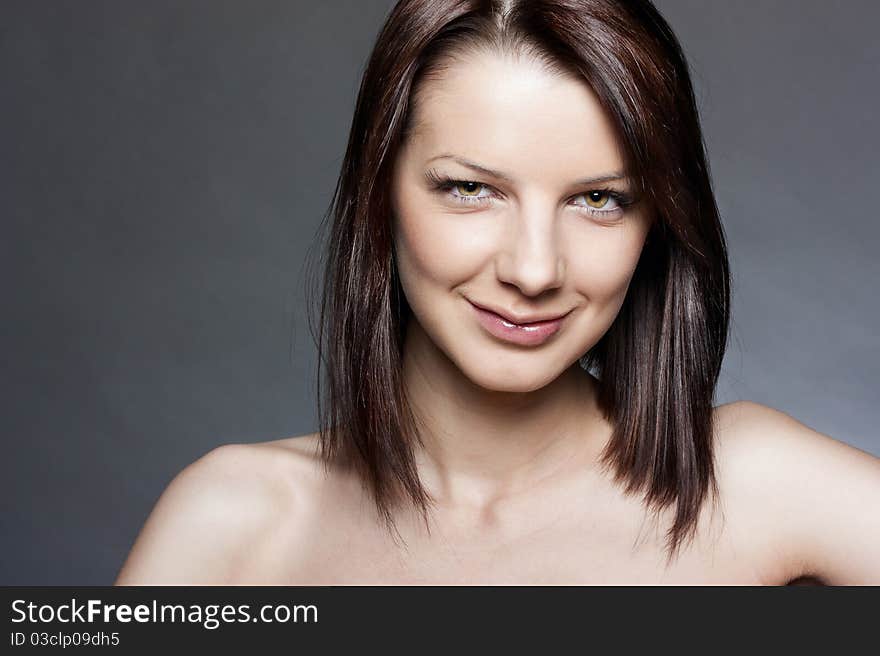 Portrait of a beautiful girl on a dark background