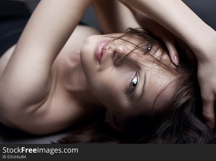 Portrait of a beautiful girl on a dark background