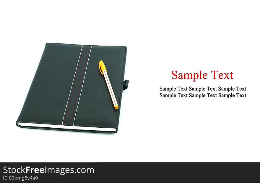 Notebook and pen isolated on a white background