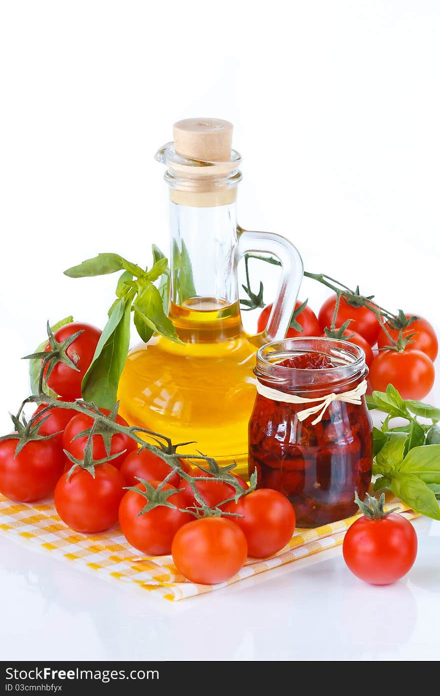 Fresh and dried cherry tomatoes in an olive oil with spices. Fresh and dried cherry tomatoes in an olive oil with spices.