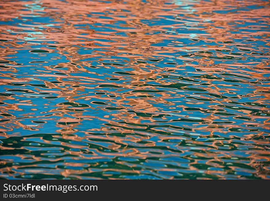 Reflection on a surface of sea water, in a bright sunny day