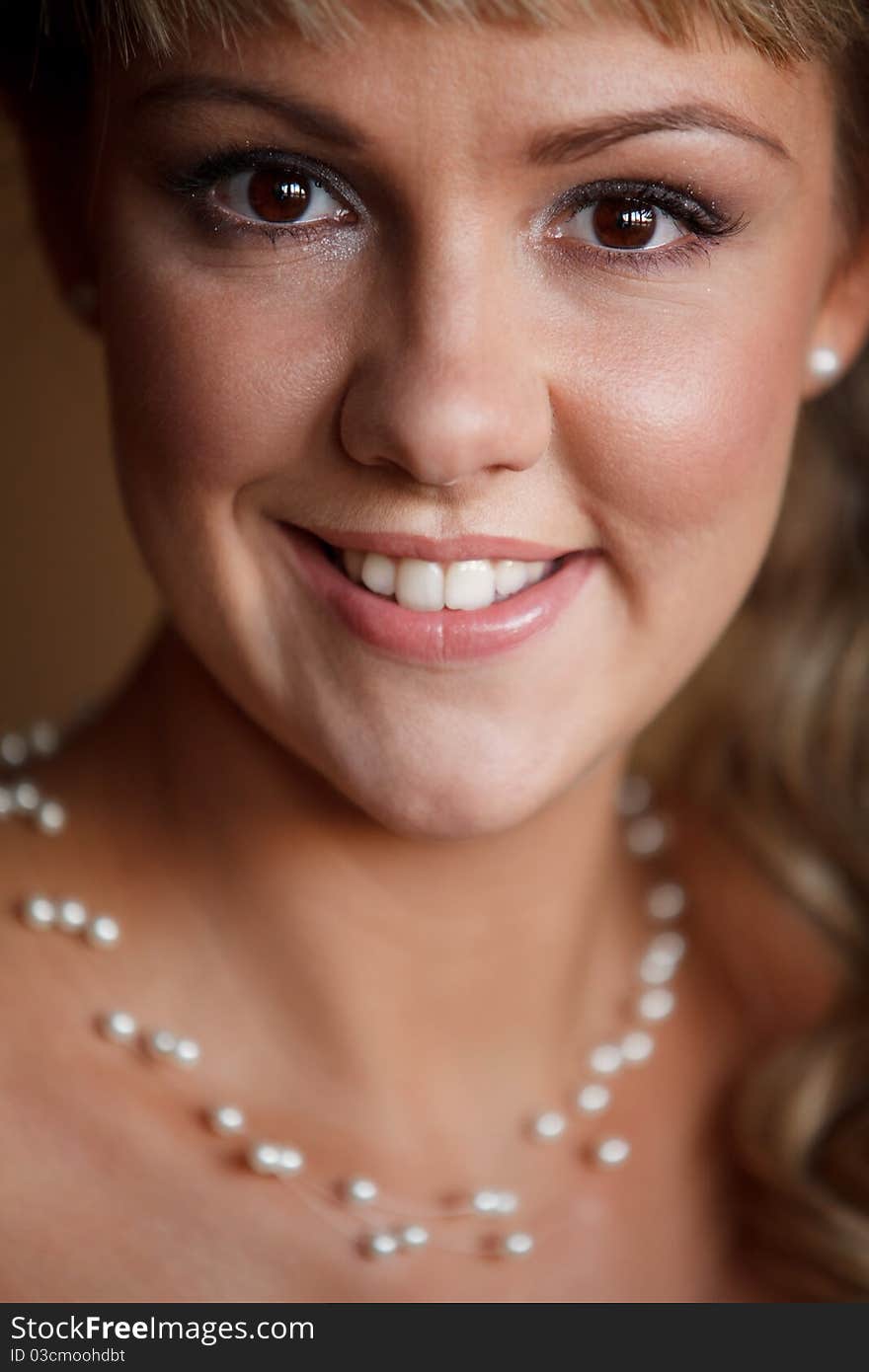 Smiling beautiful girl with pearl nacklace