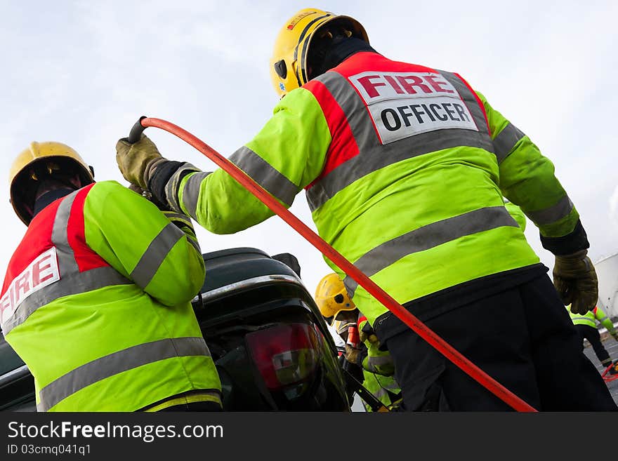 Fireman with Power Wedge at car crash