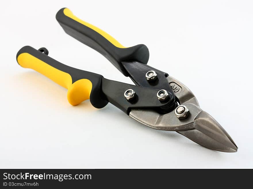 Construction tools: snips on neutral background