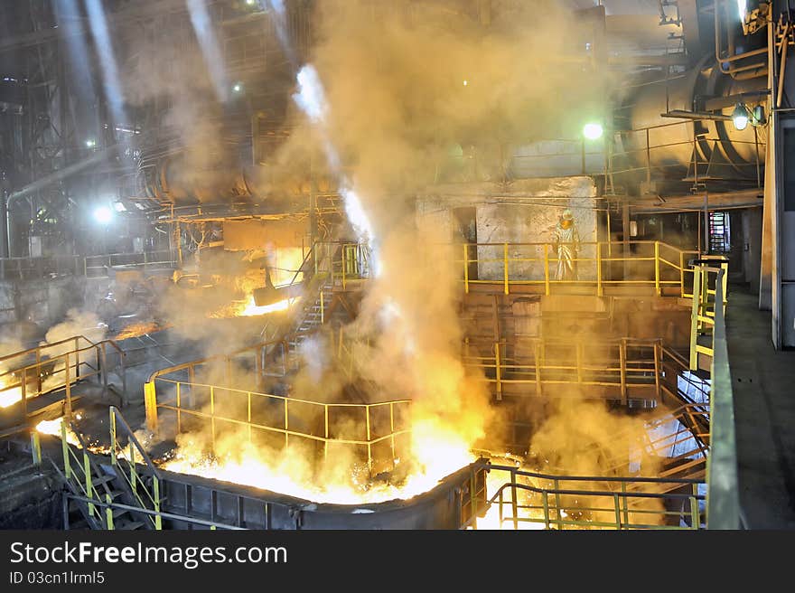 Molten hot steel pouring inside of plant