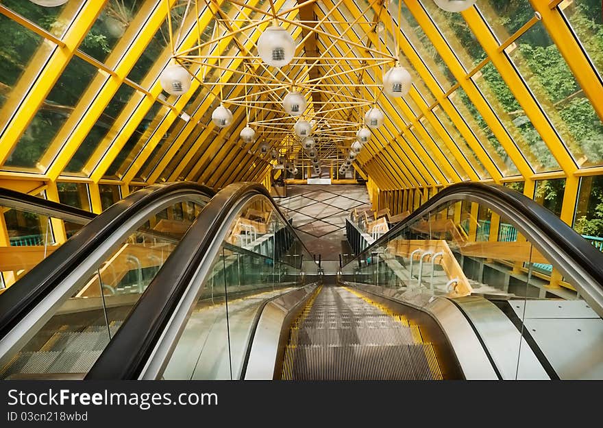 Escalator to the pedestrian bridge over the river