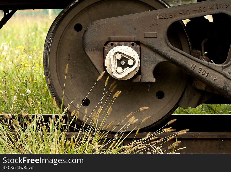 Train wheel and grass