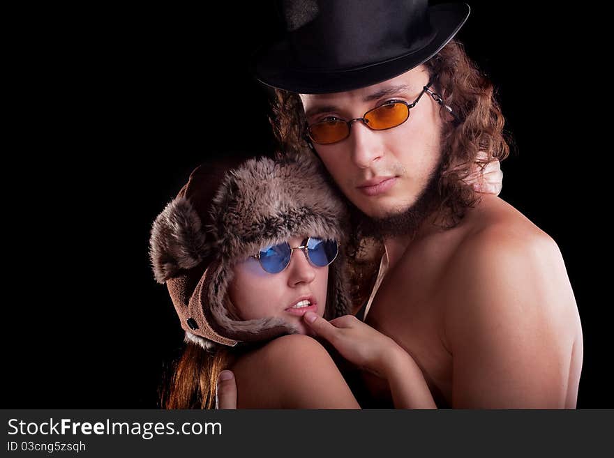 young couple. Posing in a studio. young couple. Posing in a studio