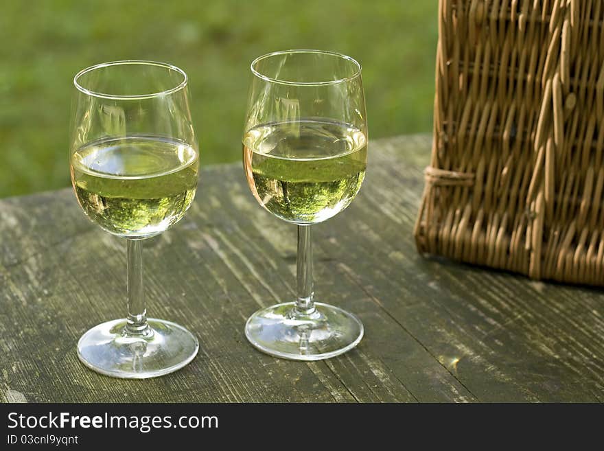 Picnic table with wineglass