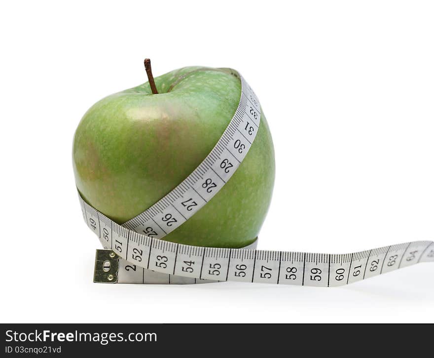 Photo of a green apple wrapped up in tailor's meter. Photo of a green apple wrapped up in tailor's meter