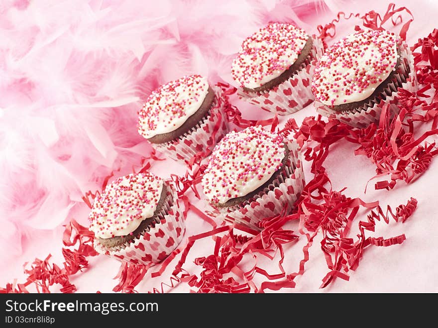 Delicious chocolate Valentine's cupcakes with pink background and copy space. Delicious chocolate Valentine's cupcakes with pink background and copy space