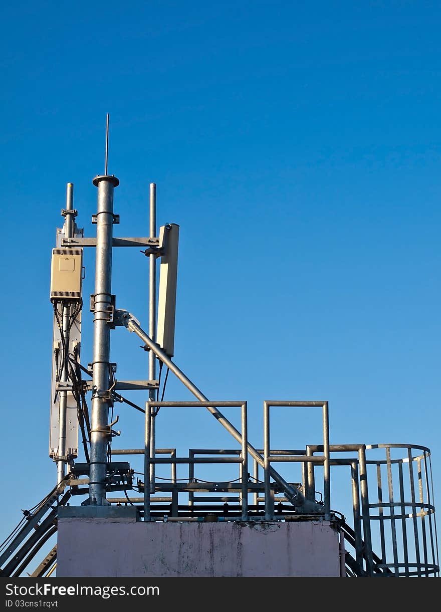 Satellite tower in evening sky