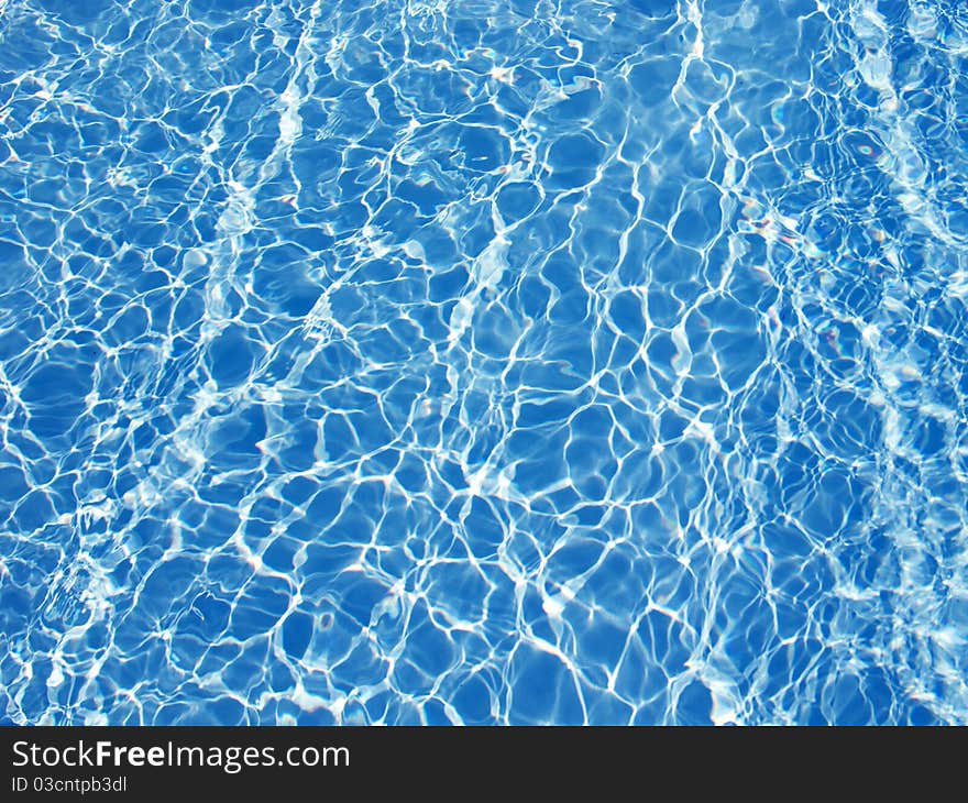 Beautiful clear pool water reflecting in the sun