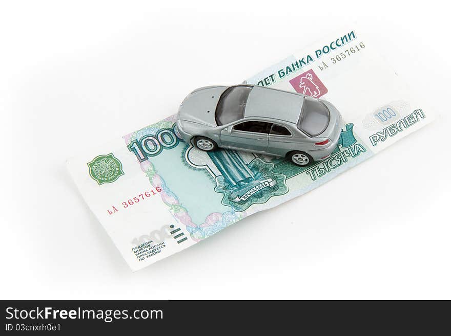 Toy car on money.