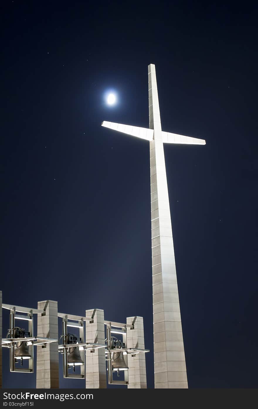 The big cross with bells at night in Rotondo Italy