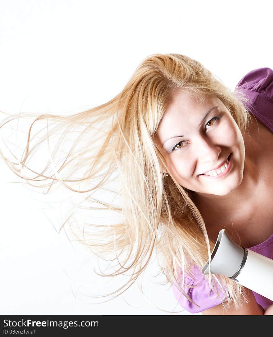 Portrait of a girl with a hairdryer