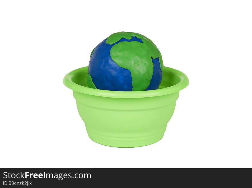 Plasticine globe in a flower pot on a white background