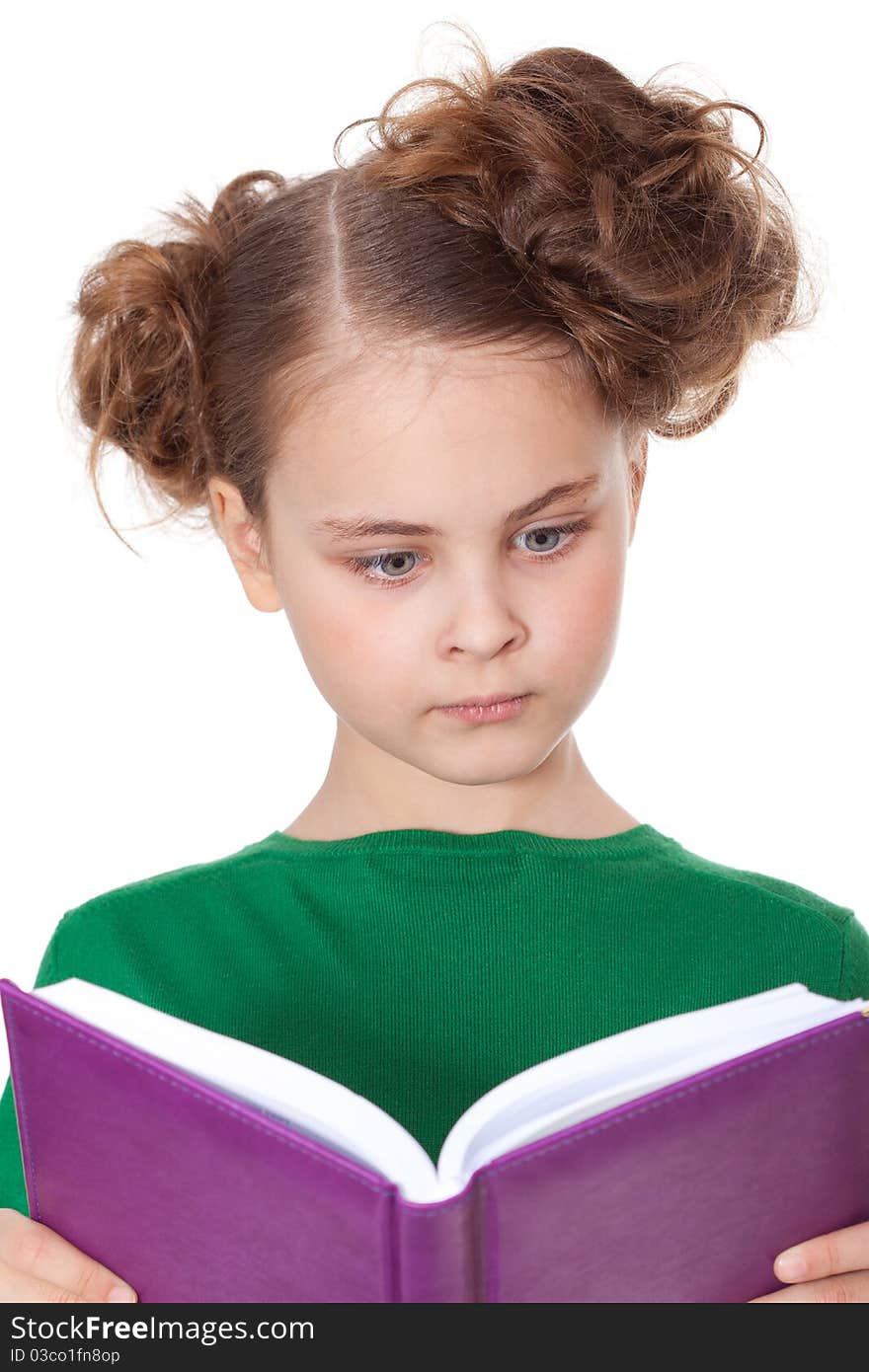 Surprised girl looking at open book